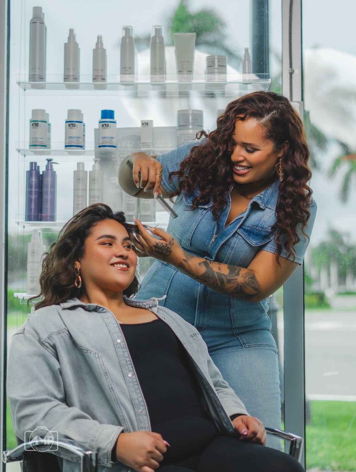 Ciara Monèt working on a client's hair in the salon