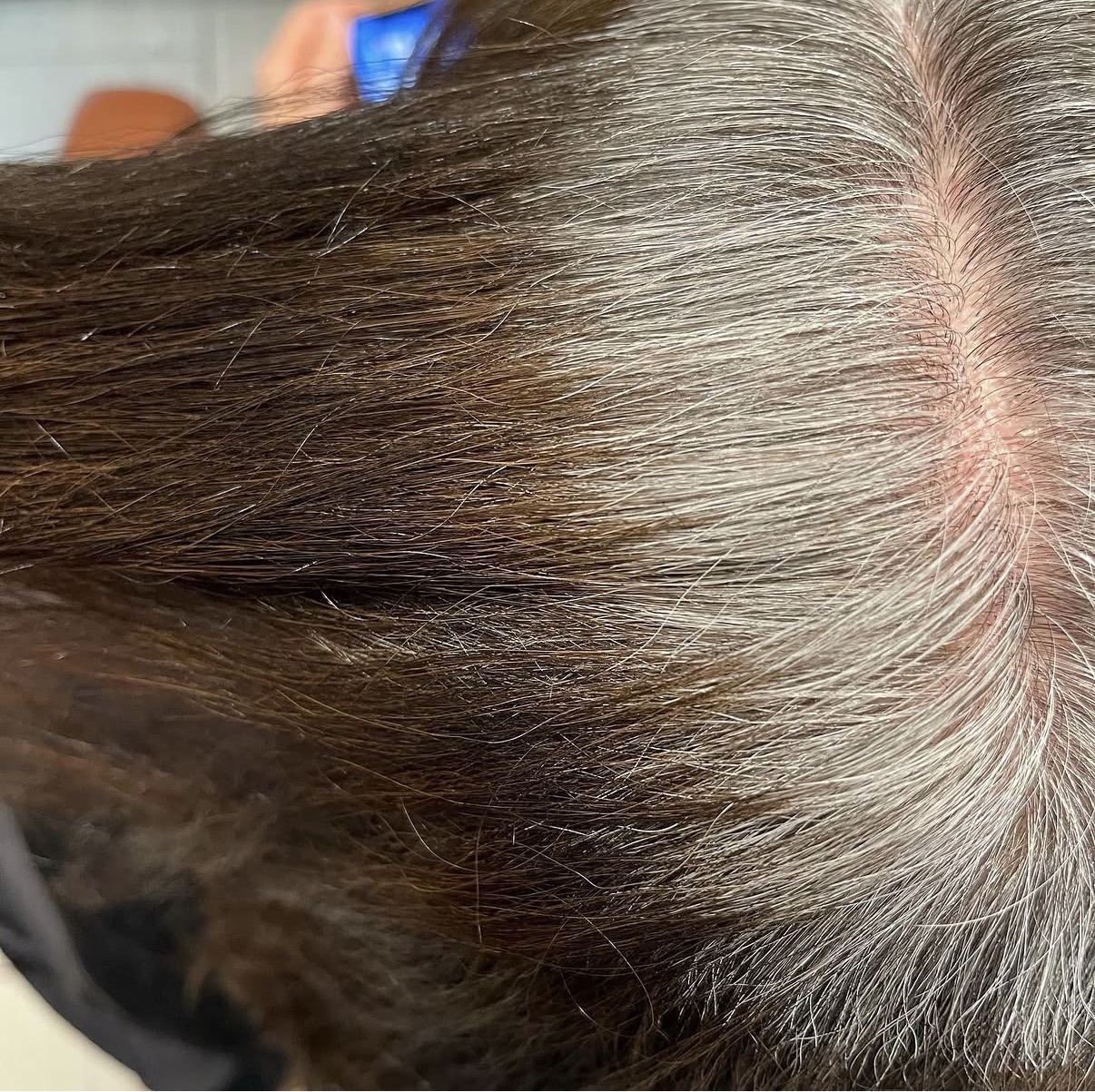 Before: close view of grey roots at the part